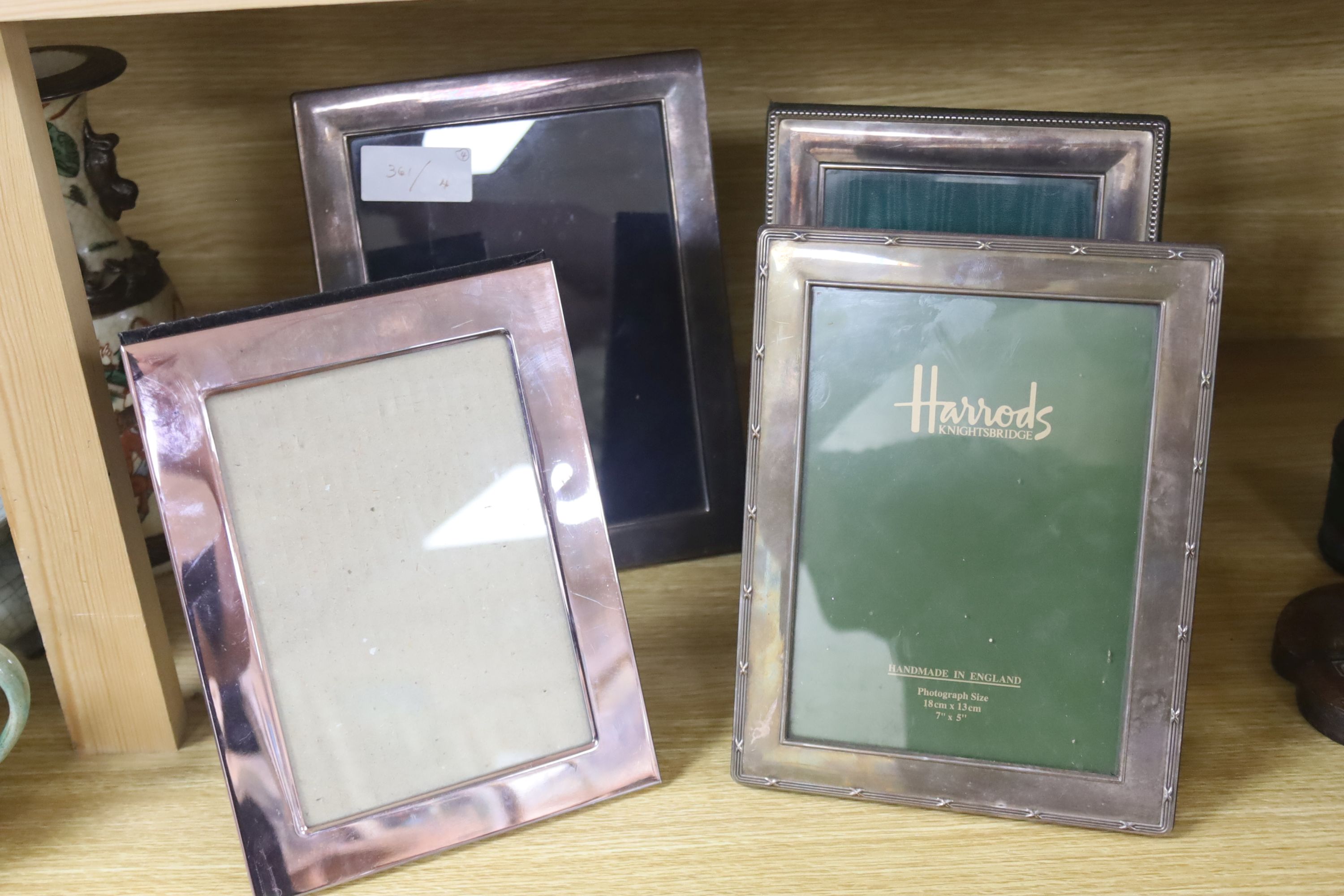 3 silver plated frames and one other, 19.5 x 14.5cm, 18 x 13cm, 17 x 12cm and 17 x 11.5cm